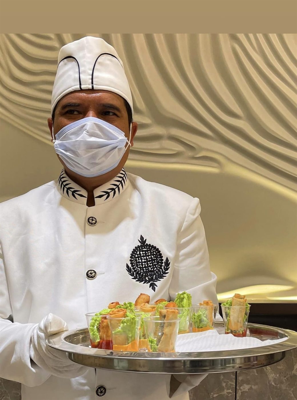 Chef serving canape starters at a corporate event
